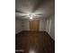 Bedroom featuring hardwood floors, a ceiling fan, and a large window at 8727 N 35Th Dr, Phoenix, AZ 85051