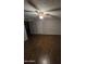 Bright bedroom with hardwood floors and a modern ceiling fan at 8727 N 35Th Dr, Phoenix, AZ 85051