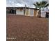 Single-story home featuring a covered parking area, desert landscaping, and a mature palm tree at 8727 N 35Th Dr, Phoenix, AZ 85051