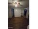 View of a living room featuring built-in shelving and a Murphy bed for convenient space saving at 8727 N 35Th Dr, Phoenix, AZ 85051