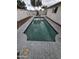 Private backyard features refreshing in-ground pool, mature landscaping, and secure fencing at 8727 N 35Th Dr, Phoenix, AZ 85051