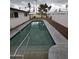 Backyard swimming pool with gray trim, metal railings, and gravel landscaping at 8727 N 35Th Dr, Phoenix, AZ 85051