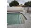 Backyard pool featuring concrete trim, metal safety rails, steps, and gated access at 8727 N 35Th Dr, Phoenix, AZ 85051