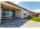 Beautiful outdoor patio with pavers, artificial grass, and sliding glass doors at 8836 S 165Th Ave, Goodyear, AZ 85338