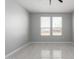 Bright bedroom features tile floors, a ceiling fan, and a window with blinds at 8836 S 165Th Ave, Goodyear, AZ 85338