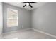 Bedroom features tile floors, a ceiling fan, and a window with blinds at 8836 S 165Th Ave, Goodyear, AZ 85338