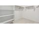 Walk-in closet with built-in shelving and hanger bars for organization at 8836 S 165Th Ave, Goodyear, AZ 85338