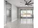 Light-filled living area with tile flooring, large sliding glass doors to the patio, and recessed lighting at 8836 S 165Th Ave, Goodyear, AZ 85338