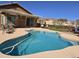 Backyard pool features a pergola, spacious patio, and scenic views of the surrounding mountains at 8965 E Red Mountain Ln, Gold Canyon, AZ 85118