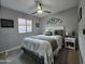 Cozy bedroom with ceiling fan, neutral walls, and decorative touches at 8965 E Red Mountain Ln, Gold Canyon, AZ 85118
