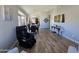 A bright dining room featuring wood-look floors and neutral walls that create a cozy ambiance at 8965 E Red Mountain Ln, Gold Canyon, AZ 85118