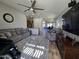 Spacious living room with a gray color palette and open access to other rooms at 8965 E Red Mountain Ln, Gold Canyon, AZ 85118