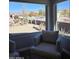 Bright sitting area with views of the desert landscape and mountains from large windows at 8965 E Red Mountain Ln, Gold Canyon, AZ 85118