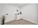 Clean laundry room with white cabinets, neutral walls, and ample space for appliances and storage at 9138 E Emerald Dr, Sun Lakes, AZ 85248