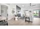 Bright and airy living room featuring modern fireplace and sliding glass doors to the backyard at 9138 E Emerald Dr, Sun Lakes, AZ 85248