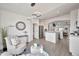 Inviting living room with stylish decor, open floor plan leading to a bright, modern kitchen at 9138 E Emerald Dr, Sun Lakes, AZ 85248