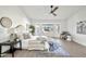 Serene main bedroom with a vaulted ceiling, lots of natural light, and tasteful decor at 9138 E Emerald Dr, Sun Lakes, AZ 85248