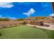 Spacious backyard with a putting green, perfect for entertaining guests at 9302 W White Feather Ln, Peoria, AZ 85383