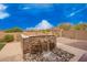 Beautiful backyard featuring a custom fire feature and tranquil water feature at 9302 W White Feather Ln, Peoria, AZ 85383