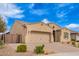 Well-maintained single-story home with a desert landscape and a two-car garage at 9302 W White Feather Ln, Peoria, AZ 85383