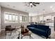 Open-concept living space featuring natural light, a view of dining area and modern, neutral decor at 9302 W White Feather Ln, Peoria, AZ 85383