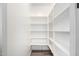 Walk-in pantry with ample shelving space for organized storage at 9302 W White Feather Ln, Peoria, AZ 85383