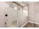 Modern shower featuring glass accents, a rainfall shower head, and built in bench at 9302 W White Feather Ln, Peoria, AZ 85383