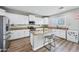 Bright kitchen featuring granite countertops, stainless steel appliances, and a kitchen island with seating at 9574 W Quail Ave, Peoria, AZ 85382