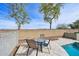 Patio area overlooking trees and mountains provides a relaxing space for outdoor dining and entertaining at 9574 W Quail Ave, Peoria, AZ 85382