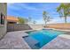 Relaxing backyard pool with travertine deck and seating area provides a luxurious outdoor retreat at 9574 W Quail Ave, Peoria, AZ 85382