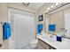 Bathroom featuring a tub/shower combination and large mirror at 9813 W Sandstone Dr, Sun City, AZ 85351