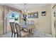 Cozy dining room features a chandelier and a window view at 9813 W Sandstone Dr, Sun City, AZ 85351