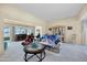 Comfortable living room with a view of the sliding glass doors at 9813 W Sandstone Dr, Sun City, AZ 85351