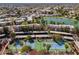 Aerial view featuring tennis courts and covered parking areas adjacent to lakeside condos at 11036 N 28Th Dr # 210, Phoenix, AZ 85029