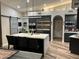 Modern kitchen features a large island with seating, stainless steel appliances, and sleek cabinetry at 11945 N 83Rd Pl, Scottsdale, AZ 85260