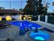 Backyard pool and spa featuring ambient lighting, creating a relaxing oasis for outdoor enjoyment at 11945 N 83Rd Pl, Scottsdale, AZ 85260