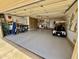 Spacious two-car garage with a golf cart, bicycles, and ample storage space at 12702 W Ashwood Dr, Sun City West, AZ 85375