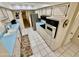 Efficient kitchen featuring white cabinets, stainless steel appliances, and blue countertops at 12702 W Ashwood Dr, Sun City West, AZ 85375