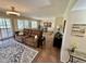 Bright living room with comfortable seating and access to a dining area with natural lighting at 12702 W Ashwood Dr, Sun City West, AZ 85375