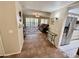 Inviting living room with tiled floor, opening to a cozy sitting area with comfortable furnishings at 12702 W Ashwood Dr, Sun City West, AZ 85375