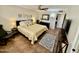 Bedroom featuring a ceiling fan, tile floor, a large bed, and an area rug at 12702 W Ashwood Dr, Sun City West, AZ 85375