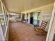 Enclosed patio with tile flooring, offering a relaxing outdoor space with golf course views at 12702 W Ashwood Dr, Sun City West, AZ 85375