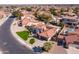 An aerial view of a neighborhood featuring houses with tile roofs and well-kept lawns at 1501 N Lesueur --, Mesa, AZ 85203
