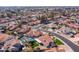Expansive aerial shot of a residential neighborhood showcasing numerous homes with private pools at 1501 N Lesueur --, Mesa, AZ 85203