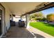 Back patio area with multiple seating areas and synthetic grass at 1501 N Lesueur --, Mesa, AZ 85203