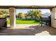 Relaxing backyard with patio, synthetic grass, grill, and well-manicured landscaping at 1501 N Lesueur --, Mesa, AZ 85203