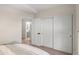 Bedroom featuring an ensuite bathroom, walk-in closet and neutral walls at 1501 N Lesueur --, Mesa, AZ 85203