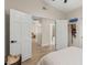 Bedroom doorway view featuring hardwood floors, and easy access to the bathroom at 1501 N Lesueur --, Mesa, AZ 85203
