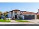 Charming single Gathering home with a welcoming entrance, manicured lawn, and a two car garage at 1501 N Lesueur --, Mesa, AZ 85203