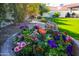 Beautiful container garden with a variety of colorful flowers in full bloom, adding charm and vibrancy to the landscape at 1501 N Lesueur --, Mesa, AZ 85203